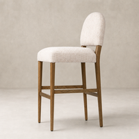 Corinne Bar + Counter Stool in Somerton Ash with soft, textured upholstery and rounded backrest.
