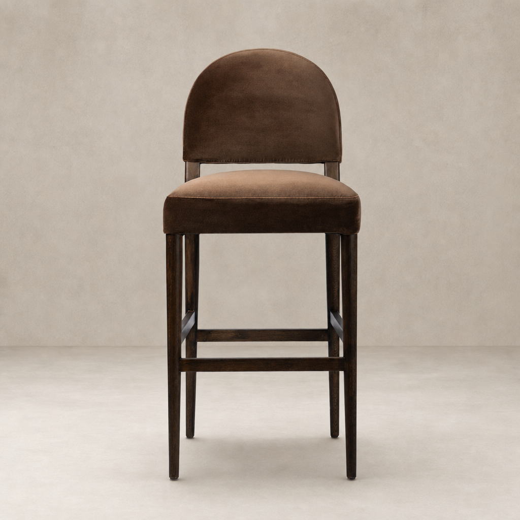 Corinne Bar + Counter Stool in Sapphire Coco, featuring a plush curved back and wooden legs.