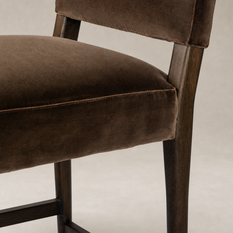 Corinne Bar + Counter Stool in Sapphire Coco features soft velvet upholstery and sturdy wooden legs.