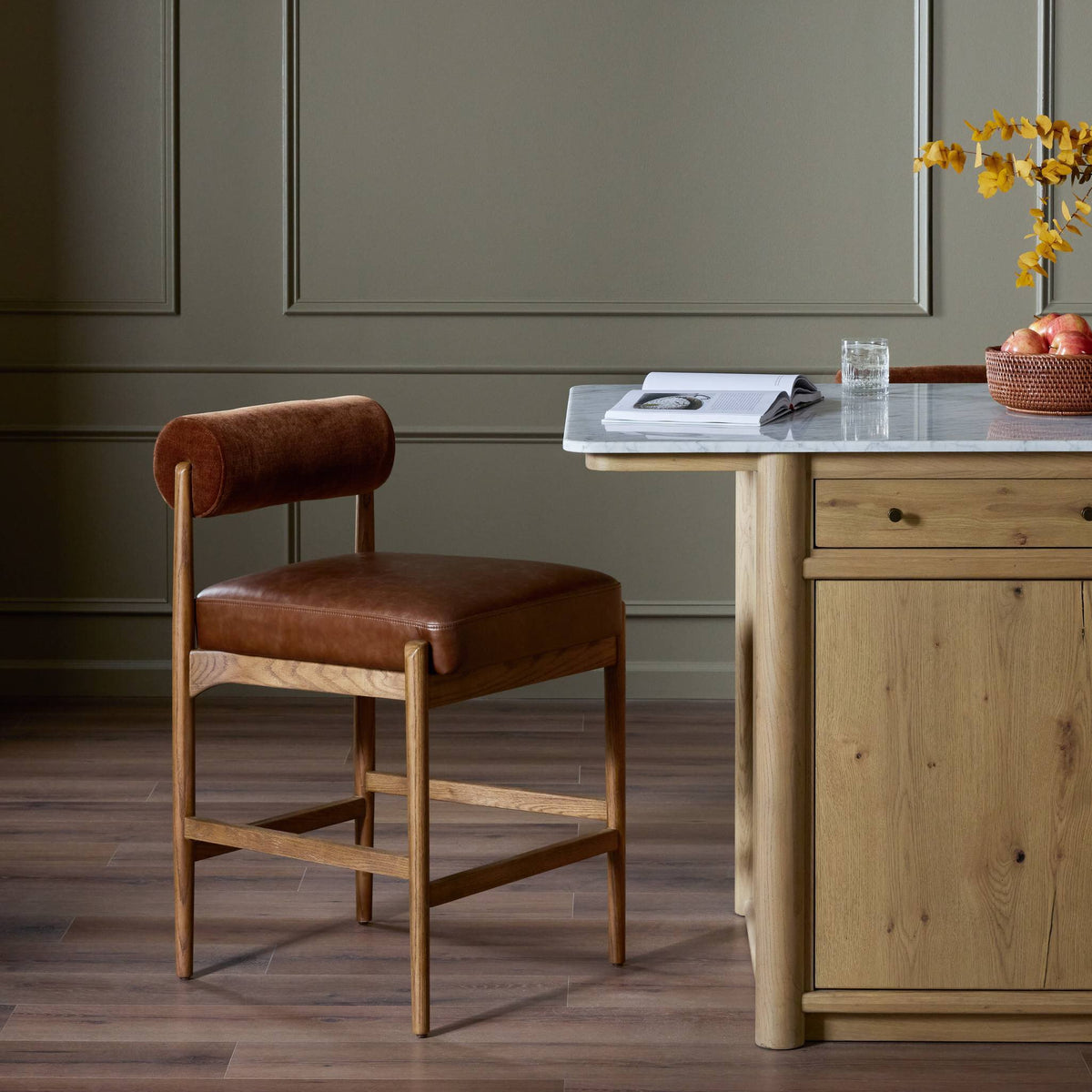 Fern Bar + Counter Stool in Altair Sienna with rounded backrest and wooden frame.