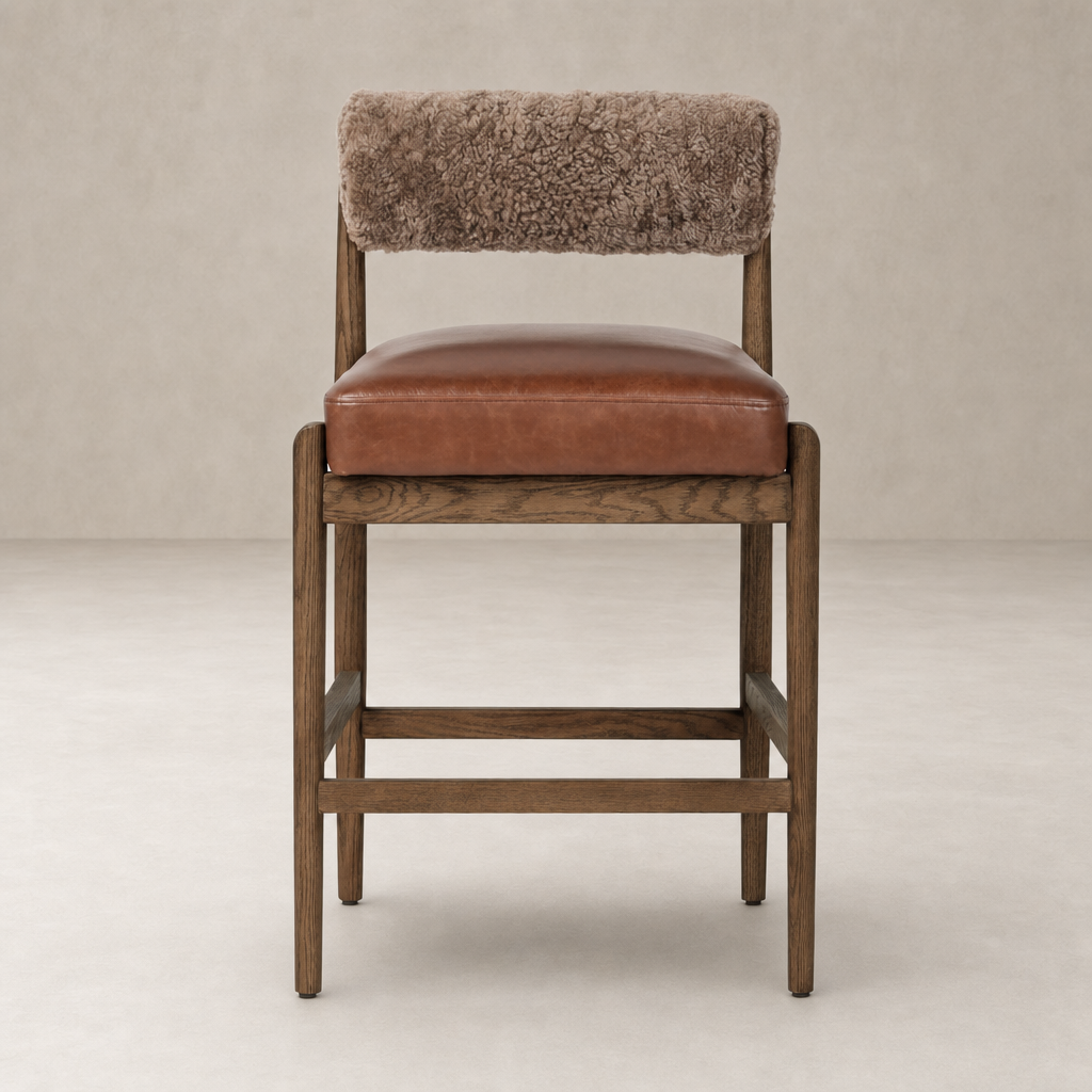 Fern Bar + Counter Stool in taupe shearling with a sleek wooden frame and plush seating.