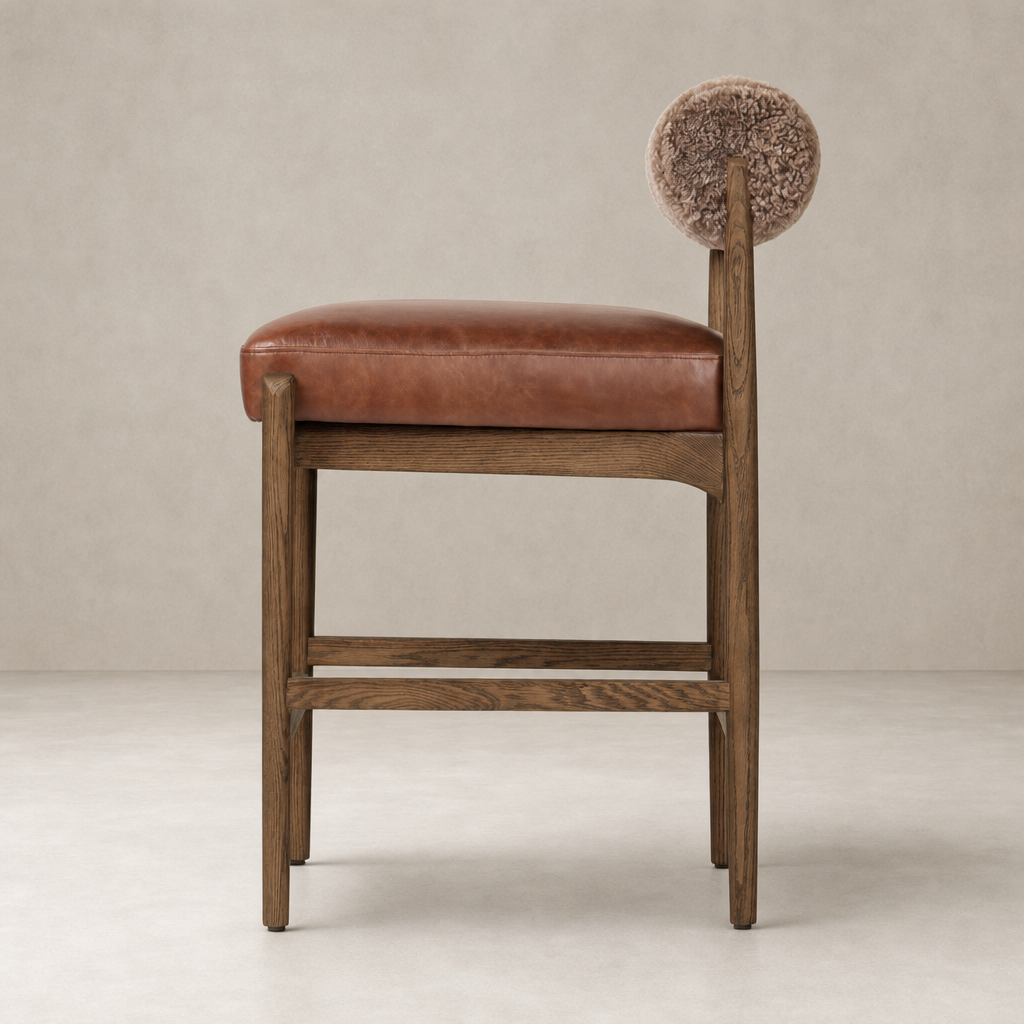 Fern Bar + Counter Stool in taupe shearling with a unique rounded backrest design.