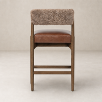 Fern Bar + Counter Stool with taupe shearling back and brown leather seat, showcasing modern design.