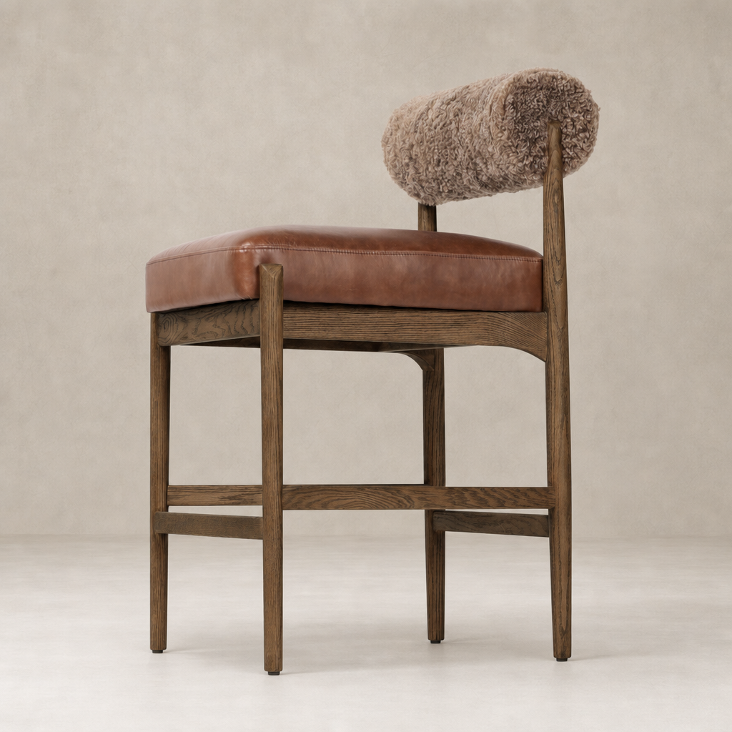Fern Bar + Counter Stool in taupe shearling with a sleek wooden frame and rounded back.