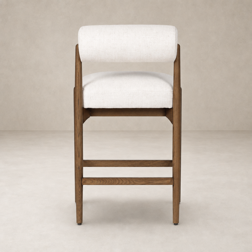 Fern Bar + Counter Stool in Dover Crescent features a sleek, upholstered design and sturdy wooden frame.