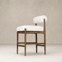 Fern Bar + Counter Stool in Dover Crescent featuring a sleek wooden frame and curved backrest.