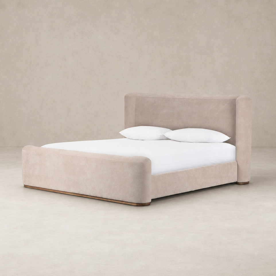 Contemporary bed in Holland Sand upholstery with plush cushioning and rounded edges.