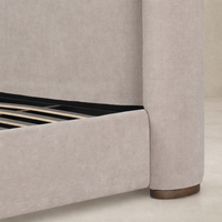 Holland Sand upholstered bed featuring sleek lines and wooden legs.
