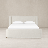 Modern bed in Crypton Nomad Snow fabric with plush headboard and clean lines.