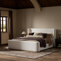 Stylish bed in Crypton Nomad Snow with plush pillows and decorative throw.