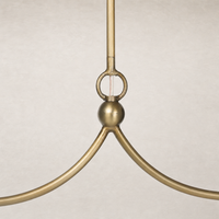 Aged brass iron chandelier with smooth curves and a round center detail.