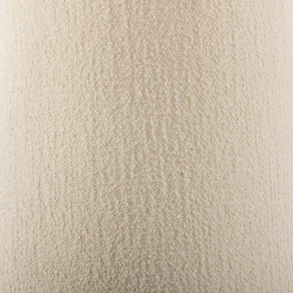 Textured close-up of a cream fabric showcasing a soft, plush surface.