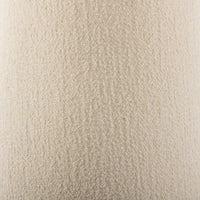 Textured close-up of a cream fabric showcasing a soft, plush surface.
