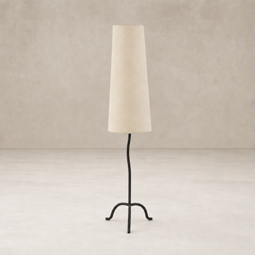 Modern black wrought iron floor lamp with a textured beige shade.