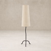 Modern black wrought iron floor lamp with a textured beige shade.