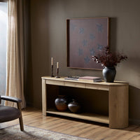 Front view of the Orla Console Table in a warm, inviting setting with decorative accents.
