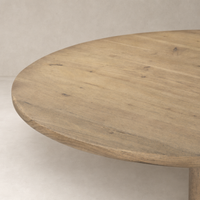 Round wooden surface of the Barlow End Table showcasing its natural grain and texture.