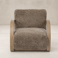Taupe shearling Roan Chair with a sleek wooden frame and plush, textured upholstery.