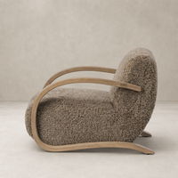 Taupe shearling Roan Chair with curved wood arms and plush upholstery.