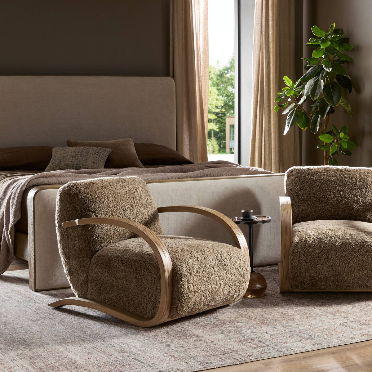 Roan Chair featuring taupe shearling upholstery in a cozy bedroom setting.