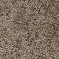 Close-up of the soft, textured taupe shearling used in the Roan Chair.