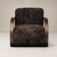 Cocoa shearling Roan Chair with elegant curved wooden arms and plush upholstery.