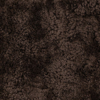 Cocoa shearling texture of the Roan Chair, showcasing its soft, fluffy surface.