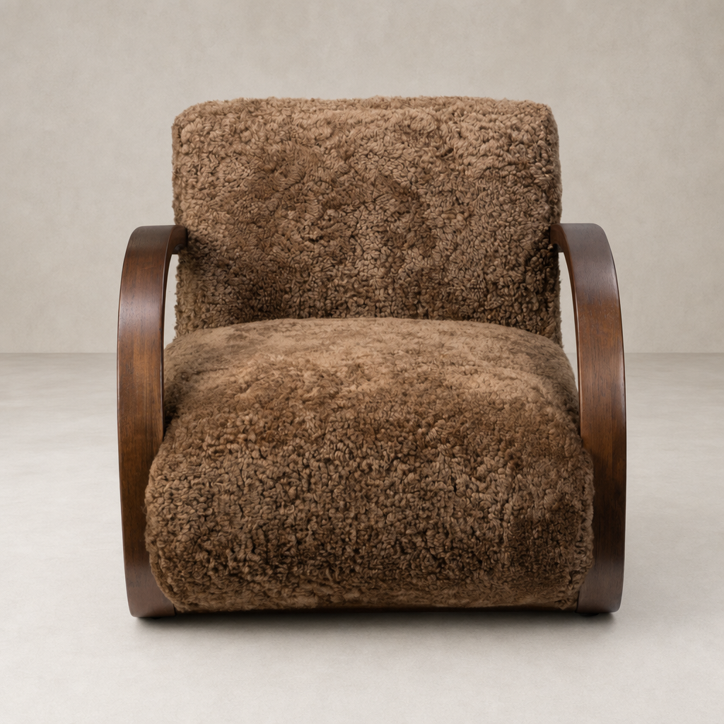 Roan Chair in amber shearling with wooden curved arms and plush texture.