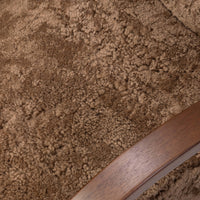 Close-up of the Roan Chair in amber shearling showcasing its soft, textured fabric.