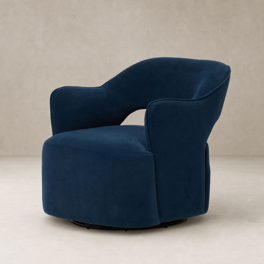 Amira Swivel Chair in Henry Navy featuring a plush, curved design and soft fabric.
