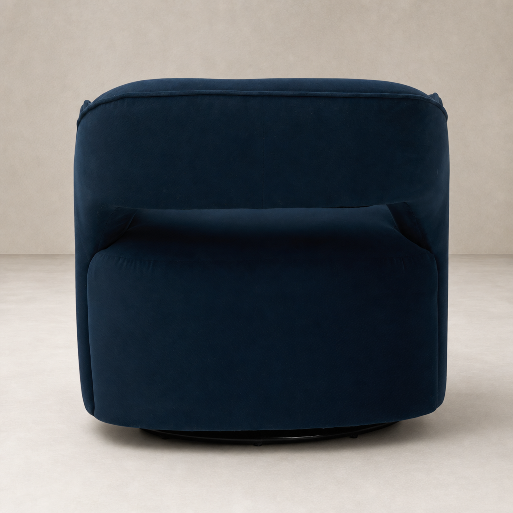 Amira Swivel Chair in Henry Navy with a plush, rounded design and sleek finish.