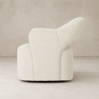 Amira Swivel Chair in natural sheepskin with a curved ergonomic design.
