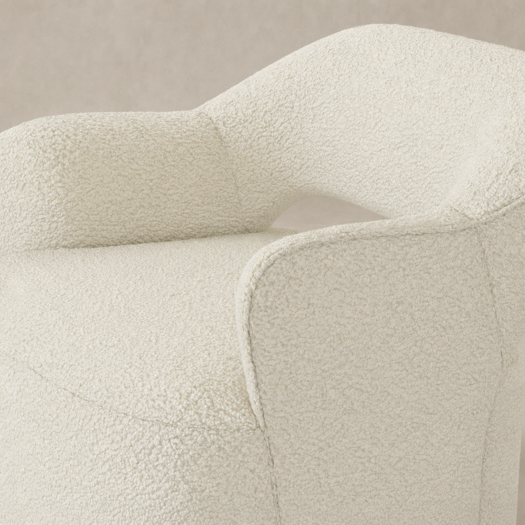 Amira Swivel Chair in Natural sheepskin with plush textured upholstery and curved armrest.