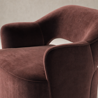 Amira Swivel Chair in Surrey Plum with smooth, curved upholstery and plush texture.