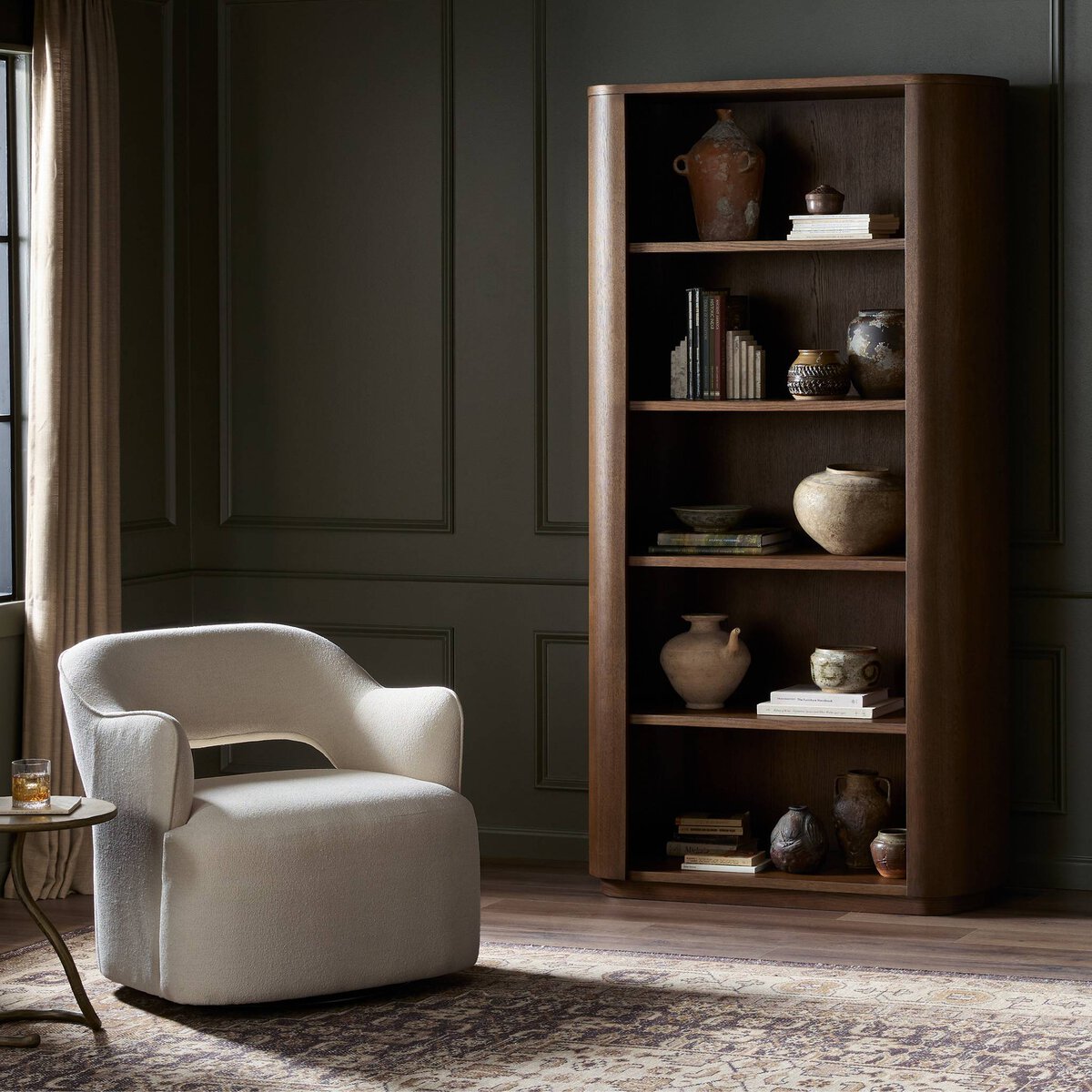 Close-up of the Cypress Bookcase showcasing its rich wood finish and decorative pottery accents.