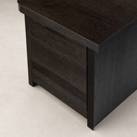 Cedar Rotating Desk in smoked black resawn oak featuring sleek lines and smooth drawer surfaces.