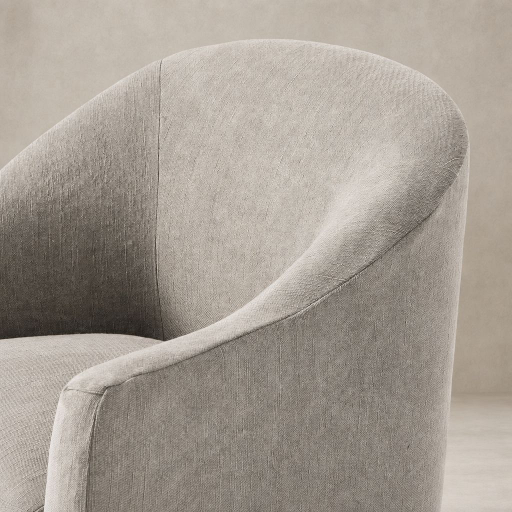 Harbor Dining Chair With Casters in Heather Twill Stone showcasing soft, textured fabric and contoured shape.
