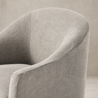 Harbor Dining Chair With Casters in Heather Twill Stone showcasing soft, textured fabric and contoured shape.