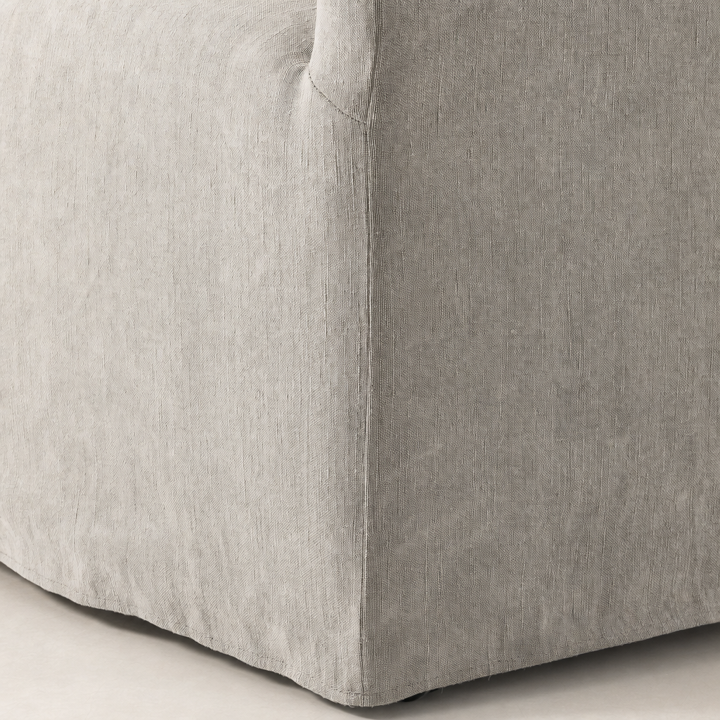 Close-up of the Harbor Dining Chair with Casters in Heather Twill Stone fabric.