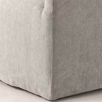 Close-up of the Harbor Dining Chair with Casters in Heather Twill Stone fabric.