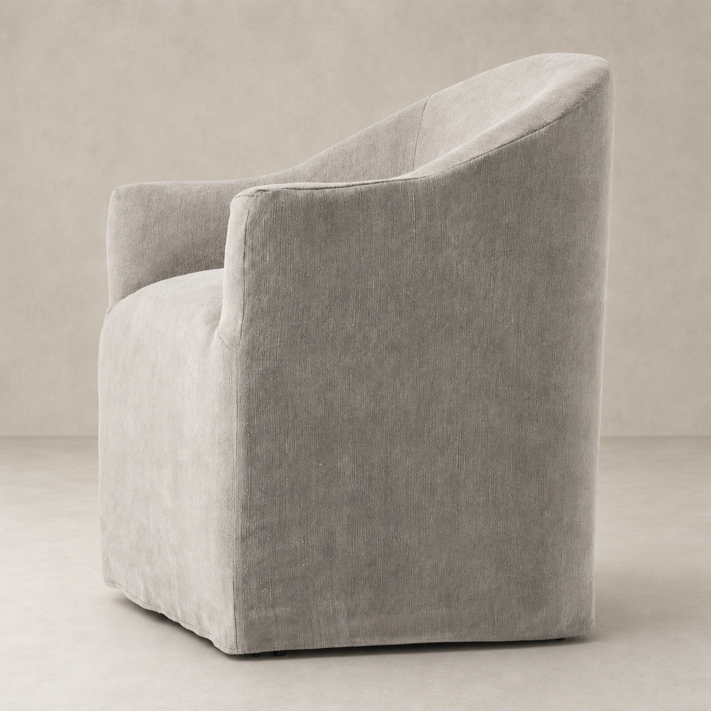 Harbor Dining Chair with Casters in Heather Twill Stone showcasing soft texture and curved design.