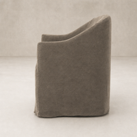 Harbor Dining Chair with casters in Broadway Coffee features a sleek, modern design.