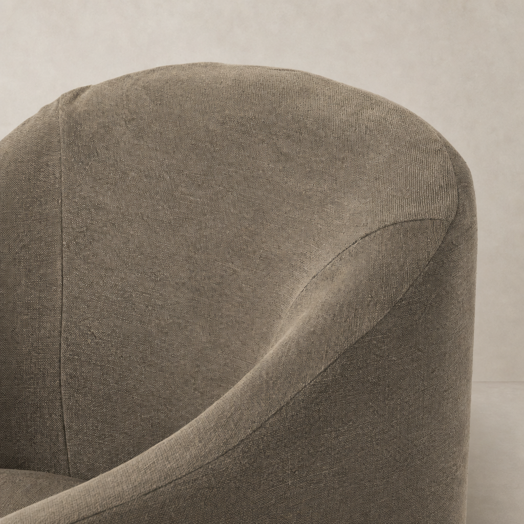 Harbor Dining Chair with Casters in Broadway Coffee, showcasing soft textured fabric and rounded shape.