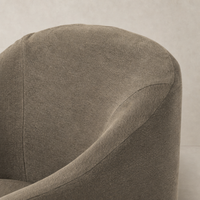 Harbor Dining Chair with Casters in Broadway Coffee, showcasing soft textured fabric and rounded shape.