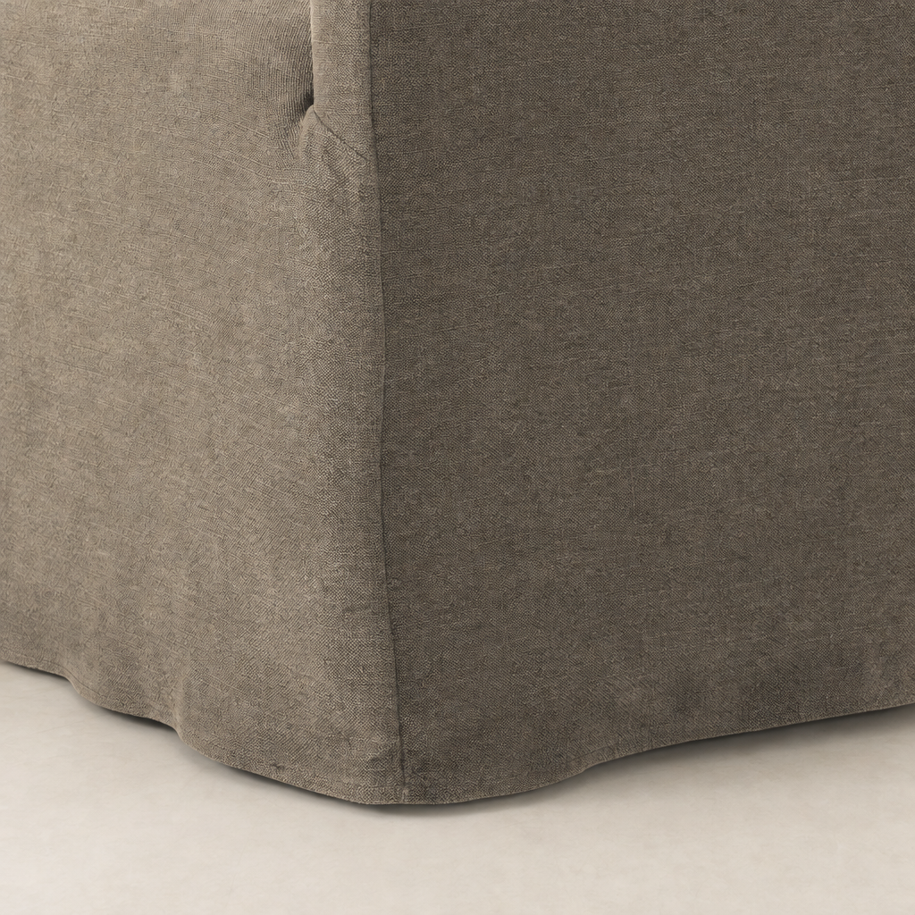 Close-up of the Harbor Dining Chair With Casters in Broadway Coffee fabric, showcasing its textured finish.