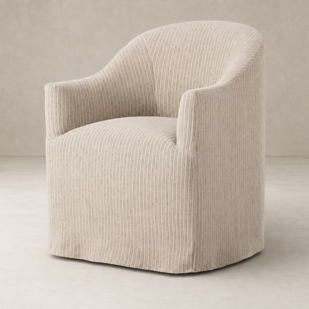 Harbor Dining Chair With Casters in Laine Navy, featuring a curved design and plush upholstery.