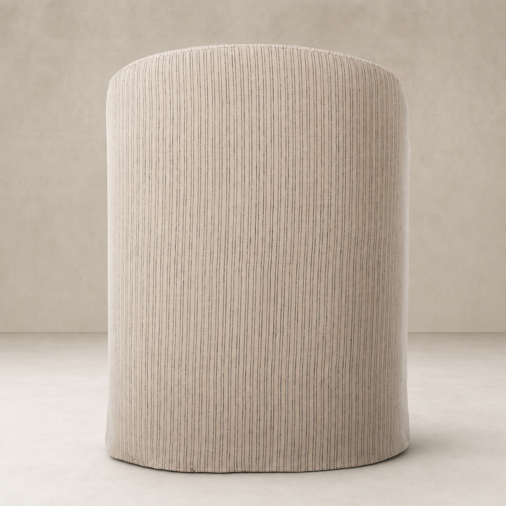 Harbor Dining Chair with Casters in Laine Navy soft upholstery and rounded shape.