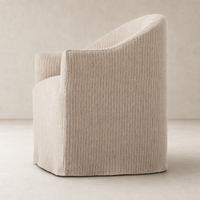 Harbor Dining Chair with Casters in Laine Navy, featuring a curved back and stylish design.