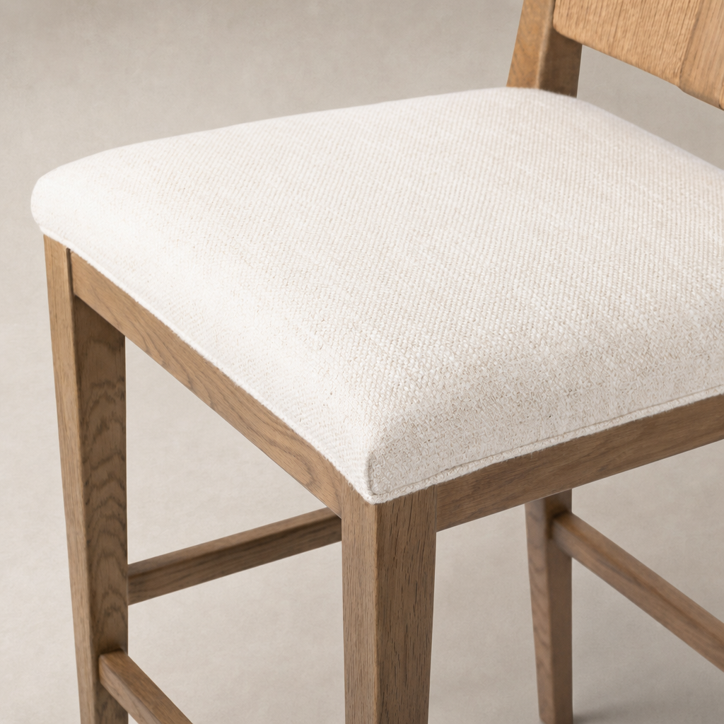 Ava Bar + Counter Stool in Dover Crescent featuring a textured cream seat and natural wood frame.