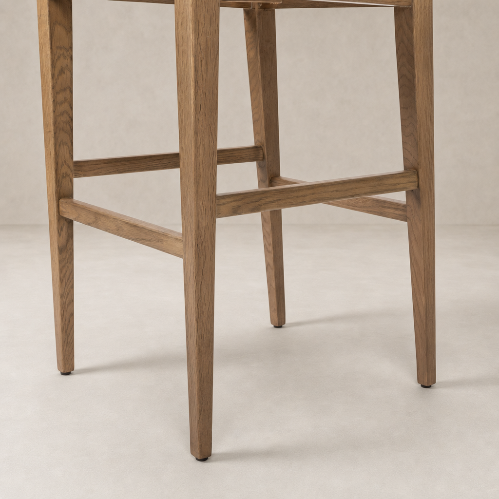 Ava Bar + Counter Stool in Dover Crescent featuring slender wooden legs and clean lines.
